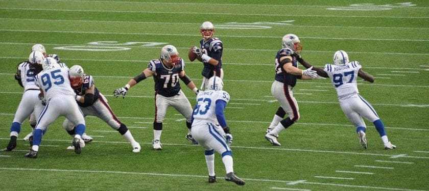 1200px-Tom_Brady_and_his_offensive_line Photo: Jack Newton - Flickr