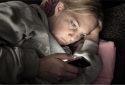 Woman using smartphone at night