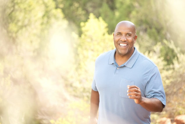 Black man jogging, fast walking.