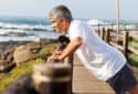 Fit older man exercising at the beach.