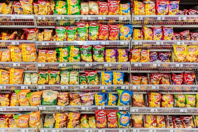 Fast food snacks on supermaket shelves.