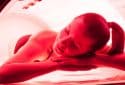 Woman on tanning bed.