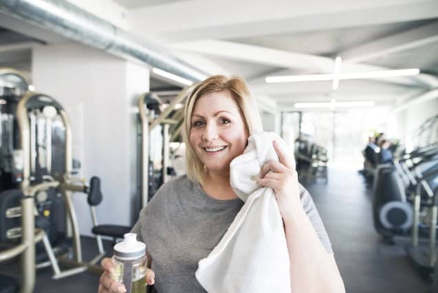 Woman resting after exercise at the gym.
